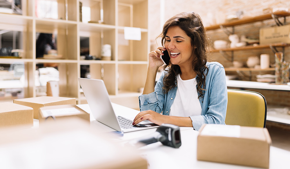 person on the phone in her office